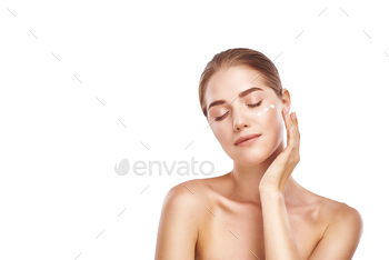 Beautiful womans face with facecream close-up studio on white. / Photodune, Misc