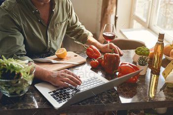 Caucasian man searching for new online recipes / Photodune, Misc