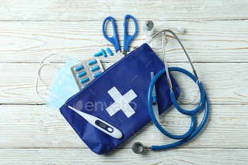 First aid medical kit on white wooden table / Photodune, Misc