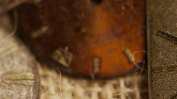 Rotating stock footage shot of antique and weathered watch faces 