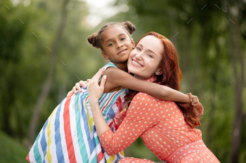 Loving caring mother hugging her cute appealing daughter / Photodune, Misc