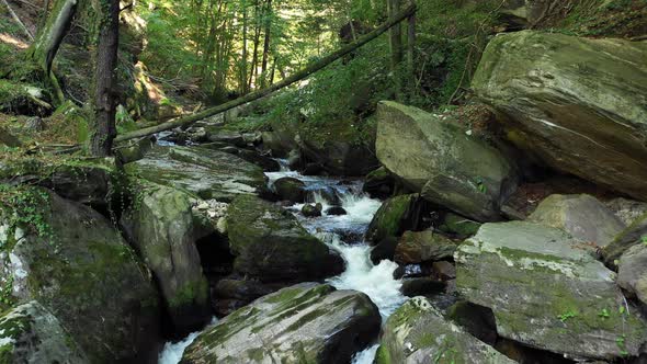 Mountain river flowing over rocks and boulders in forest, Bistriski Vintgar gorge on Pohorje mountai