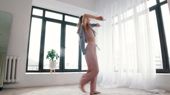 Street Dancing  Young Woman Dances in White Room