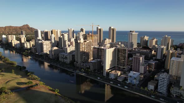 Honolulu and Waikiki Beach Aerial Pull Back of Buildings at Sunset