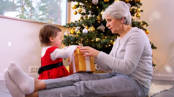 Grandmother and Baby Girl with Christmas Gifts