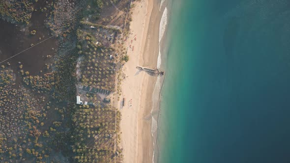 Aerial Top Down of Ocean Waves Washed Sand Beach