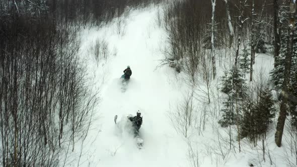 Snowmobiling up a mountain side in Canada