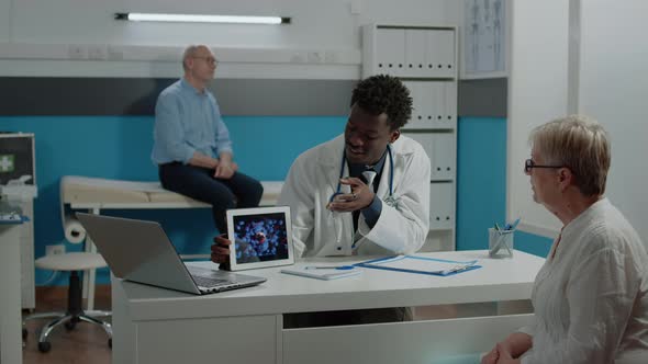 Medical Specialist Holding Modern Tablet with Virus Animation