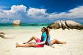 Couple at tropical beach wearing rash guard - PhotoDune Item for Sale