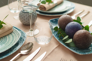 Luxury green table setting decorated with candles / Photodune, Misc