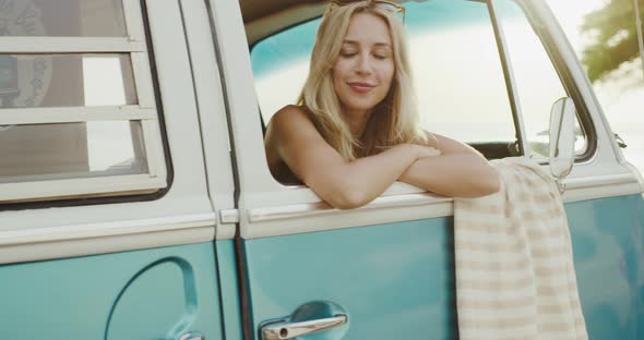 Beautiful Surfer Girl in Vintage Van