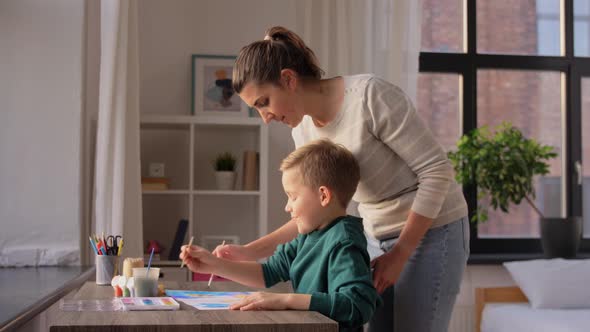 Mother and Son with Colors Drawing at Home