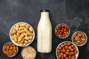 Vegan non dairy nut milk and heaps of different nuts top view / Photodune, Misc