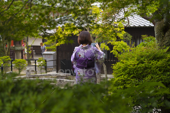 Women tourism wear a traditional dress called Kimono for travelling in Kyoto / Photodune, Misc
