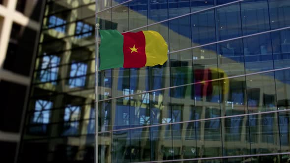 Cameroon Flag Waving On A Skyscraper Building
