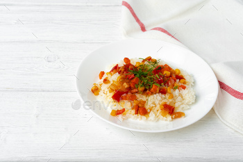 Prepared rice with vegetables on white wooden table / Photodune, Misc