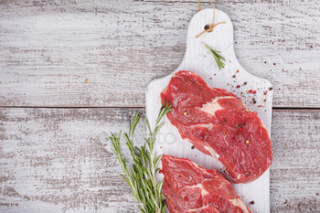 Raw fresh beef steak on a white cutting board / Photodune, Misc