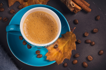 Blue cup of coffee with coffee beans and autumnal dry leaves / Photodune, Misc