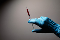 Doctor's hand with blood probe. Coronavirus test - PhotoDune Item for Sale