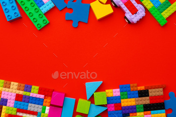 Plastic constructor details on red background close up / Photodune, Misc