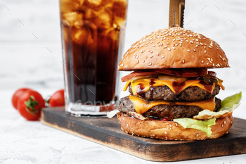 Freshly cooked burger on wooden board on light background / Photodune, Misc