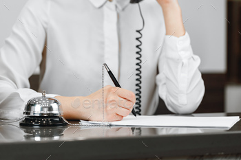 Close up of modern hotel reception counter desk / Photodune, Misc