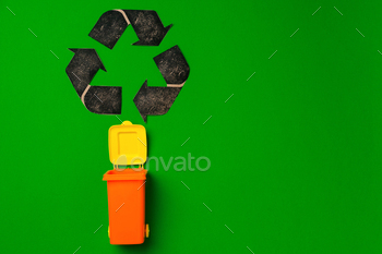 Garbage sorting concept with toy waste bin on paper background / Photodune, Misc