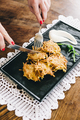 Potato pancakes or latkes or draniki with sour cream in plate on white wooden table. - PhotoDune Item for Sale