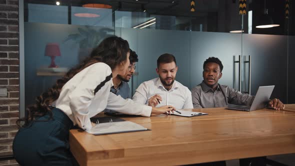 Young Ambitious Multiracial Employees Discuss Project Teamwork Startup Advertising Professionals