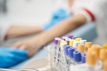 Focused photo on test tubes that being on the foreground / Photodune, Misc