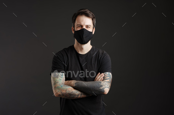 White brunette man in face mask posing and looking at camera / Photodune, Misc