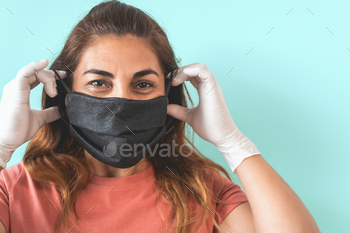Mature Latin woman portrait wearing protective face mask and gloves / Photodune, Misc