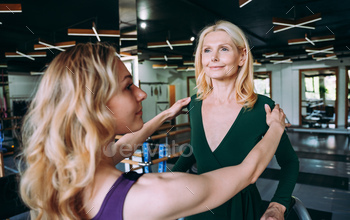 senior woman doing phisycal rehabilation and pilates with her coach / Photodune, Misc