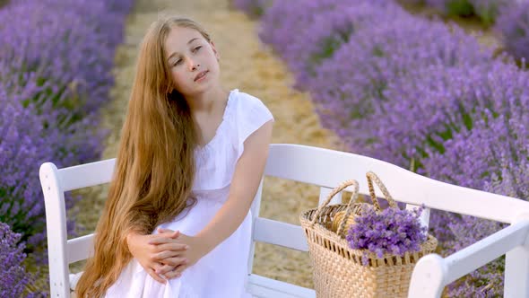 Girl Sitting on a Bench