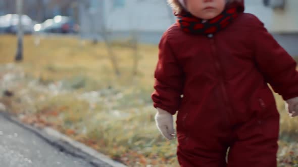 Toddler Children Running. Infant Kid On In Warm Fashion Jumpsuit Walking. Little Girl Having Fun.