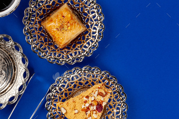 Halva dessert with tea cup on blue background / Photodune, Misc