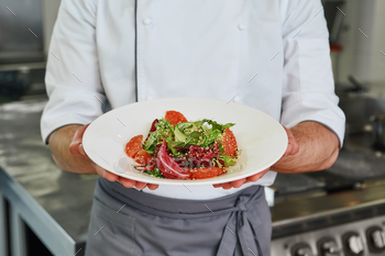 It s good mood food. Close up of chef cooked salad / Photodune, Misc