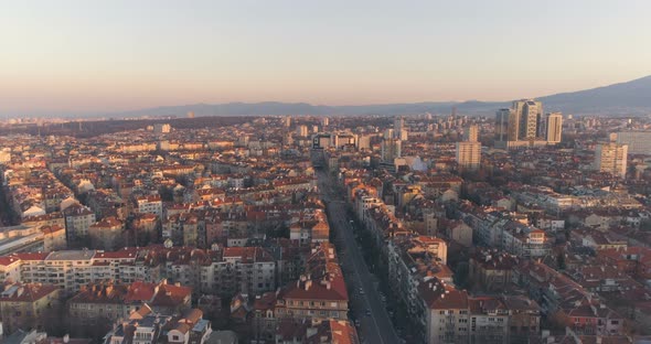 Sofia Panoramic View at Sunset with Calm City Traffic on Long Boulevard alt