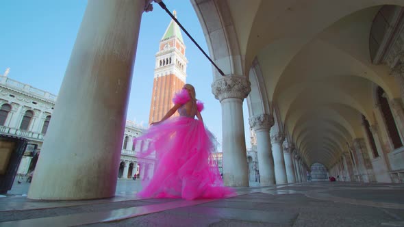 Girl in Pink Elegant Dress in San Marco Square in Venice