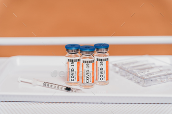 Covid-19 vaccine bottles and medications / Photodune, Misc