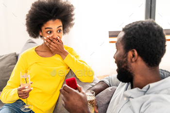 Afro american couple celebrating at home / Photodune, Misc