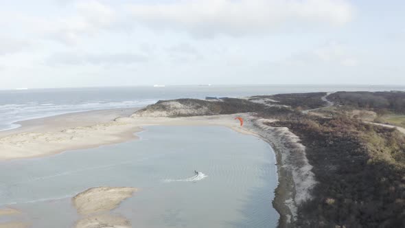 Arial view of a person doing windsurf in Retranchement, Netherlands.