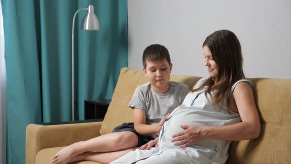 Pregnant Mom and Son on the Couch