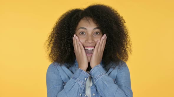 African Woman Feeling Surprised Yellow Background