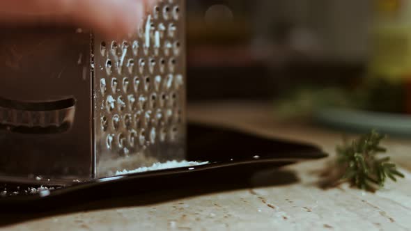 Grated Cheese on a Table Full of Vegetables