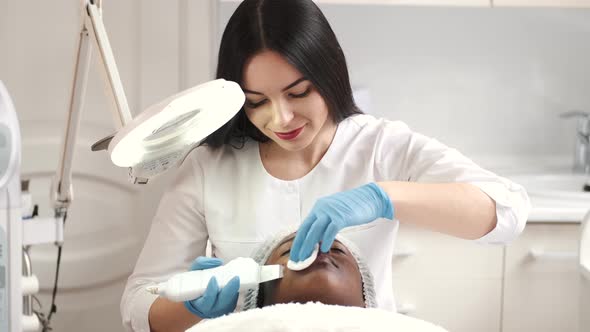 Beautician Makes Procedure for Clean Face with Hardware