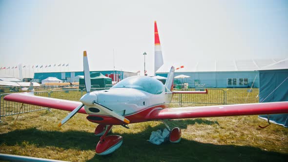 A Colorful Airplane with Front Valve - an Outdoors Airplane Exposition - Summer