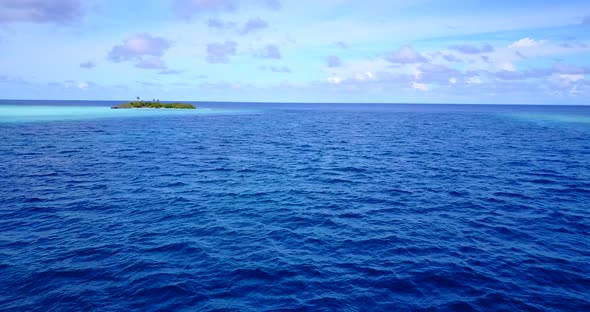 Wide angle flying island view of a paradise sunny white sand beach and aqua turquoise water backgrou