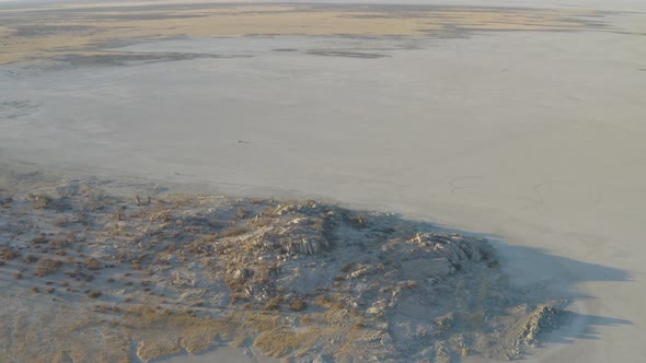 Drone Shot Of Spectacular og Empty Rocky Desert At Kubu Island Near Makgadigadi Pans, Botswana. - Ae