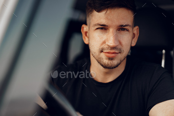 ow of his off-road car, close up portrait